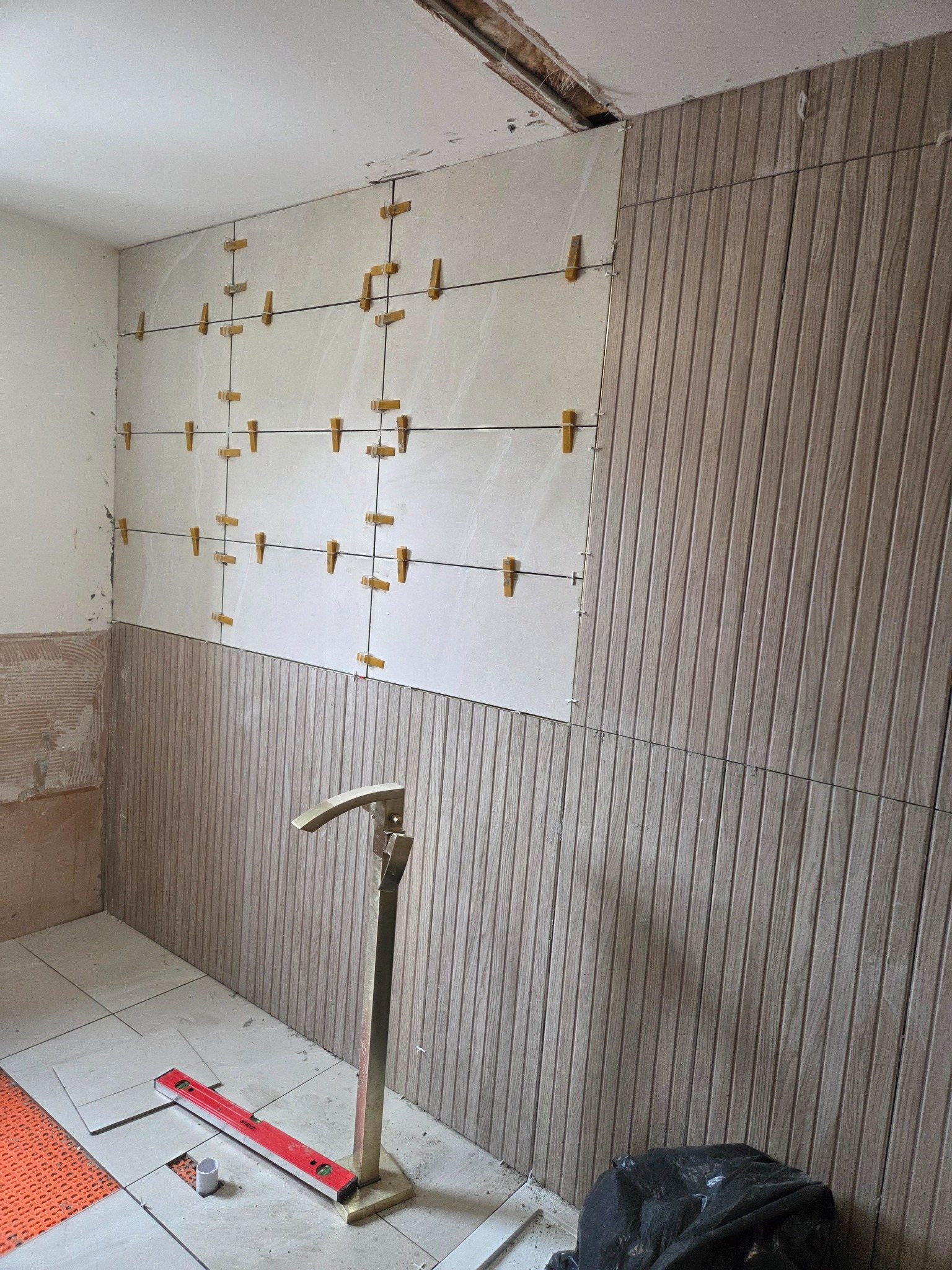 Bathroom tiling in progress