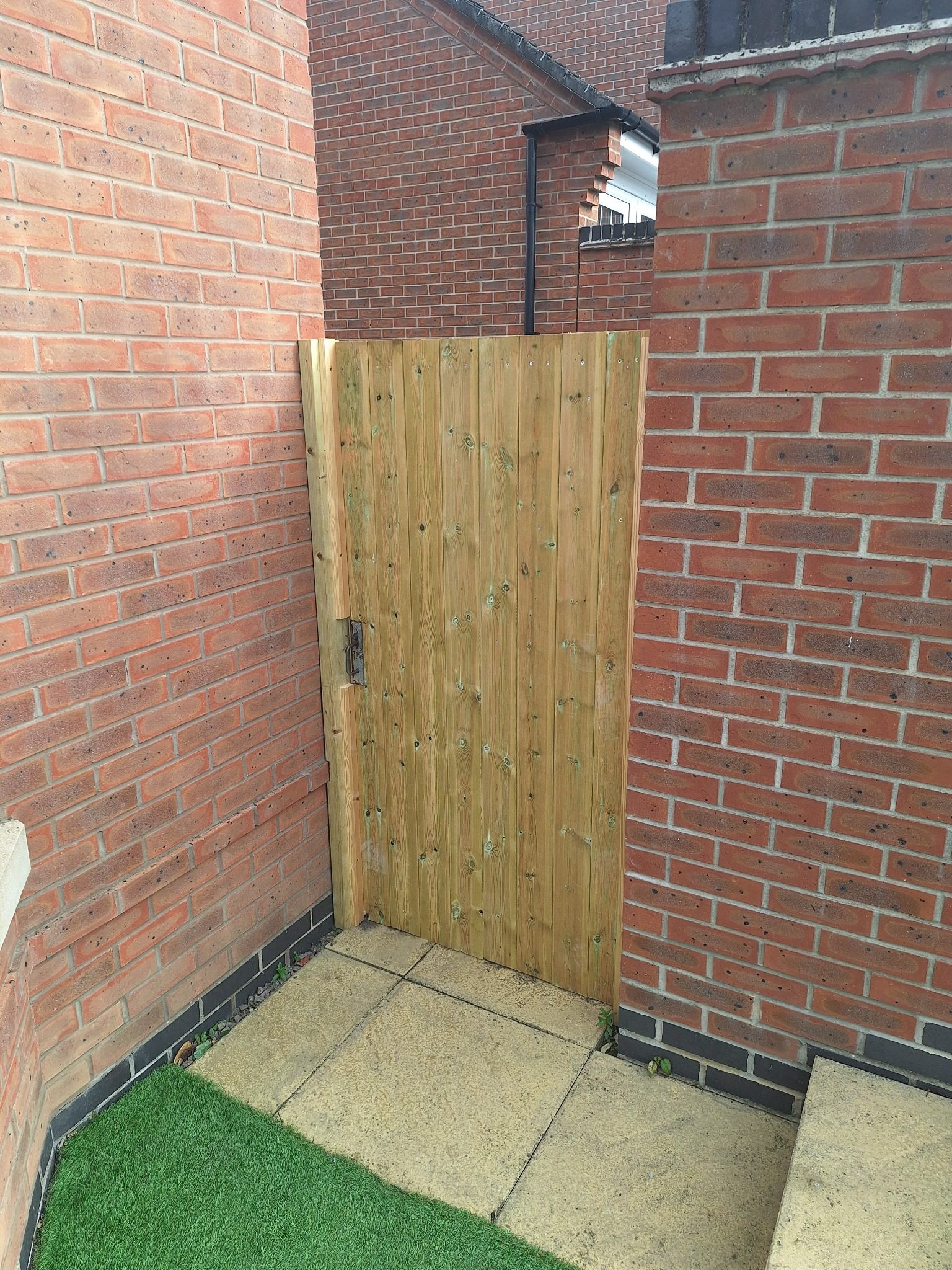 Outdoor property improvement with new timber gate
